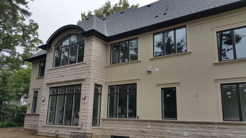 Limestone home with columned entry