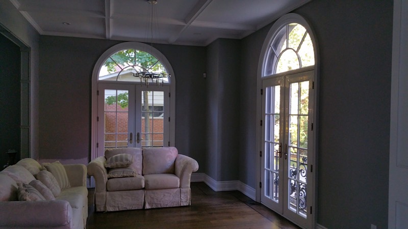 Limestone home with columned entry