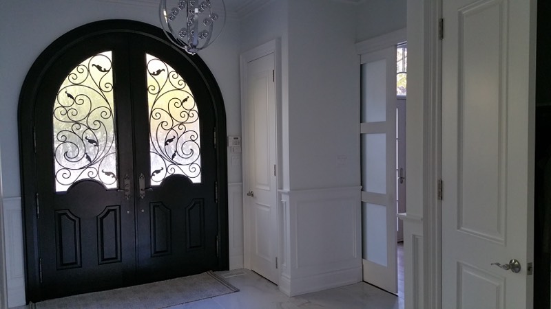 Limestone home with columned entry