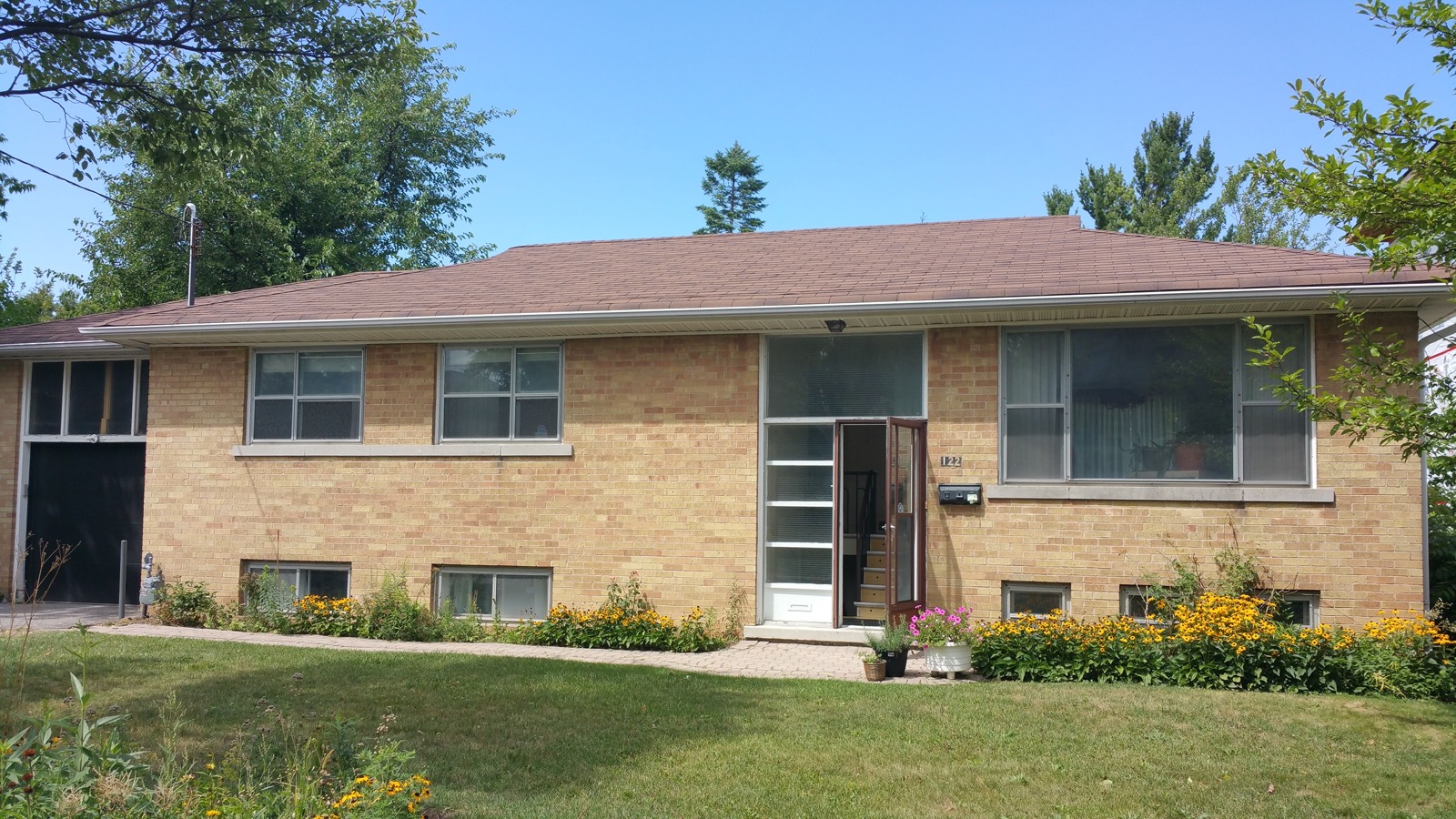 Side split home before and after a rear addition and exterior rebuild